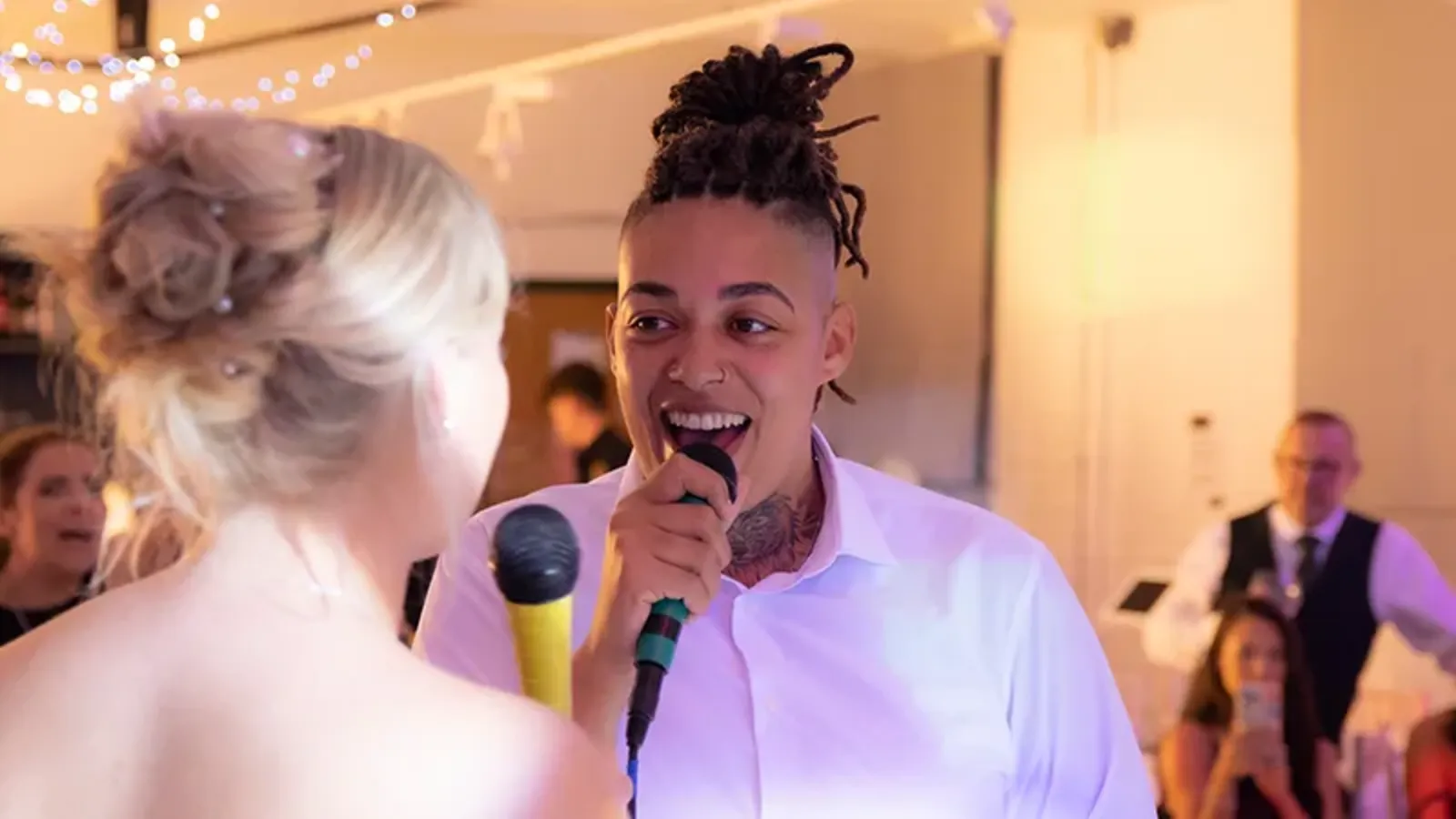 Karaoke party with dual microphones and guests singing